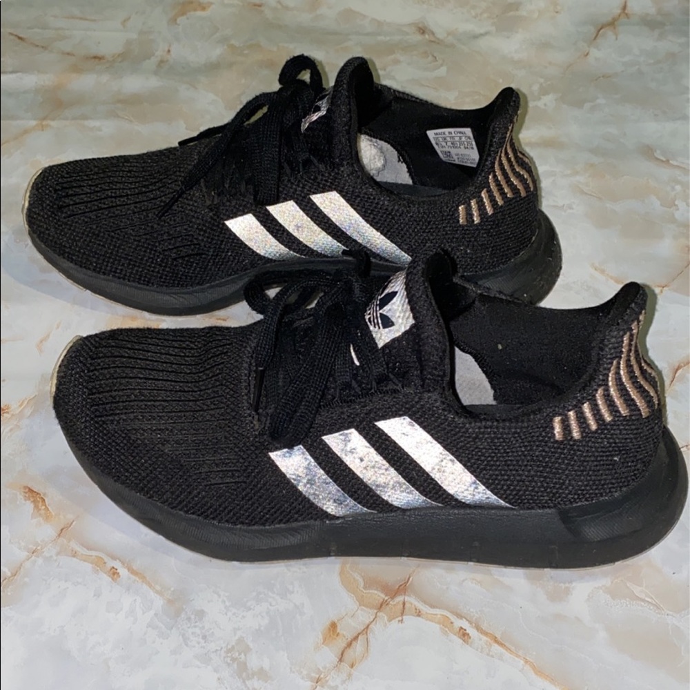 Black women’s Adidas tennis shoes